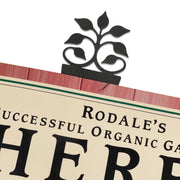 Leaf Fan Bookmark -Textured clipped onto a book page, showcasing its elegant leaf design and functionality for readers.