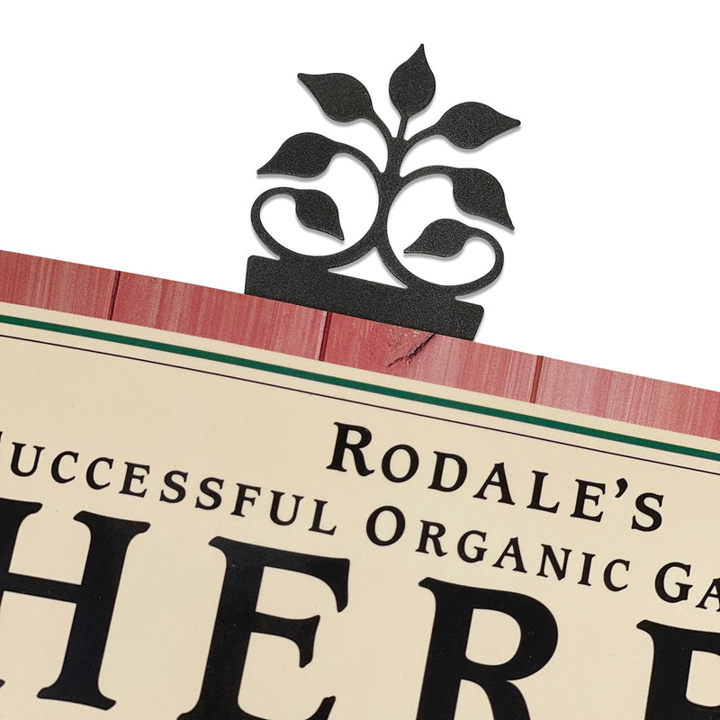 Leaf Fan Bookmark -Textured clipped onto a book page, showcasing its elegant leaf design and functionality for readers.