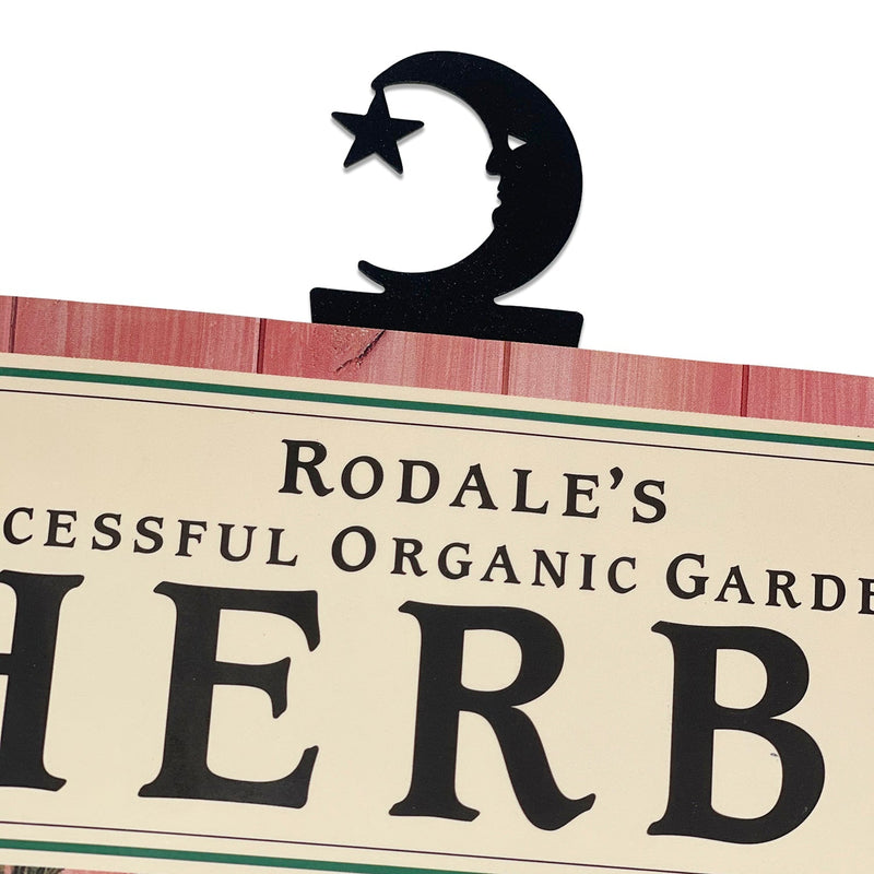 Moose & Star Bookmark -Textured clipped onto a book, showcasing its decorative moon and star top for stylish page marking.