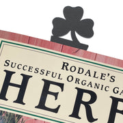 Textured Shamrock Bookmark clipped onto a book page, showcasing its decorative clover top. Perfect for home-office or gift use.