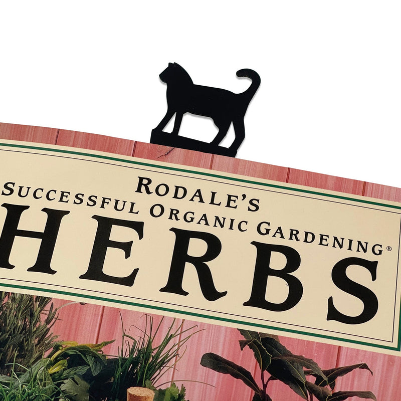 Textured Cat Bookmark clipped onto a book, showcasing its decorative cat silhouette design for stylish page marking.