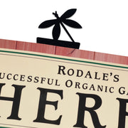 Dragonfly Bookmark -Textured clipped onto a book page, showcasing its decorative dragonfly top and sturdy metal construction for office or home use.