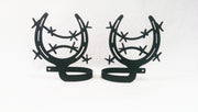 Decorative horseshoe curtain holdbacks in matte black finish featuring barbed wire accents, perfect for farmhouse or country-style interiors.