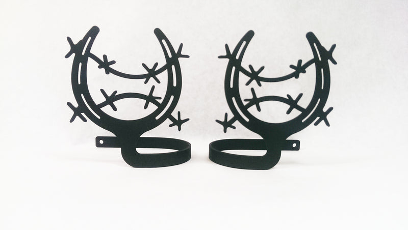 Decorative horseshoe curtain holdbacks in matte black finish featuring barbed wire accents, perfect for farmhouse or country-style interiors.