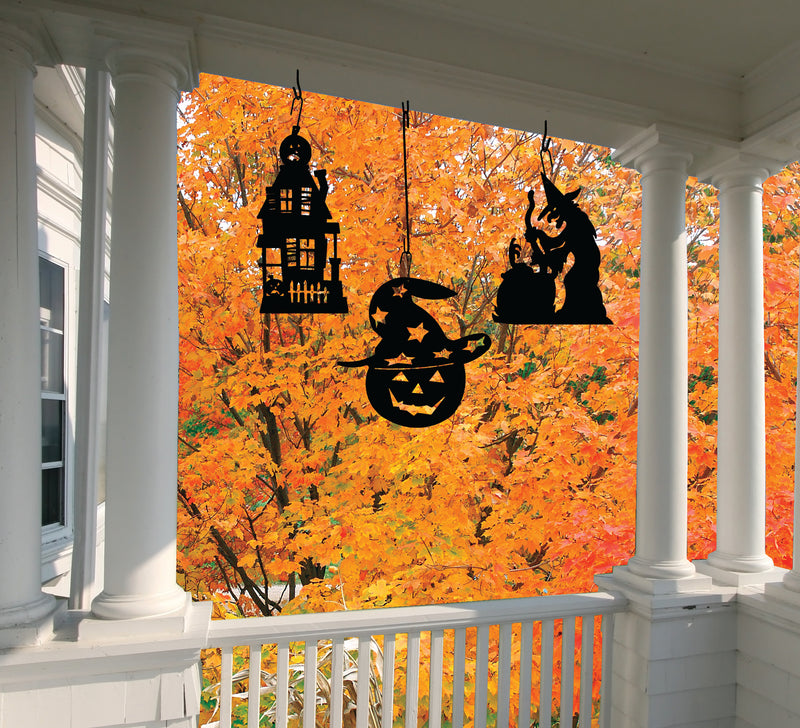 Pumpkin Hat Hanging Silhouette Decor displayed on a porch with autumn foliage, perfect seasonal accent for outdoor Halloween décor.