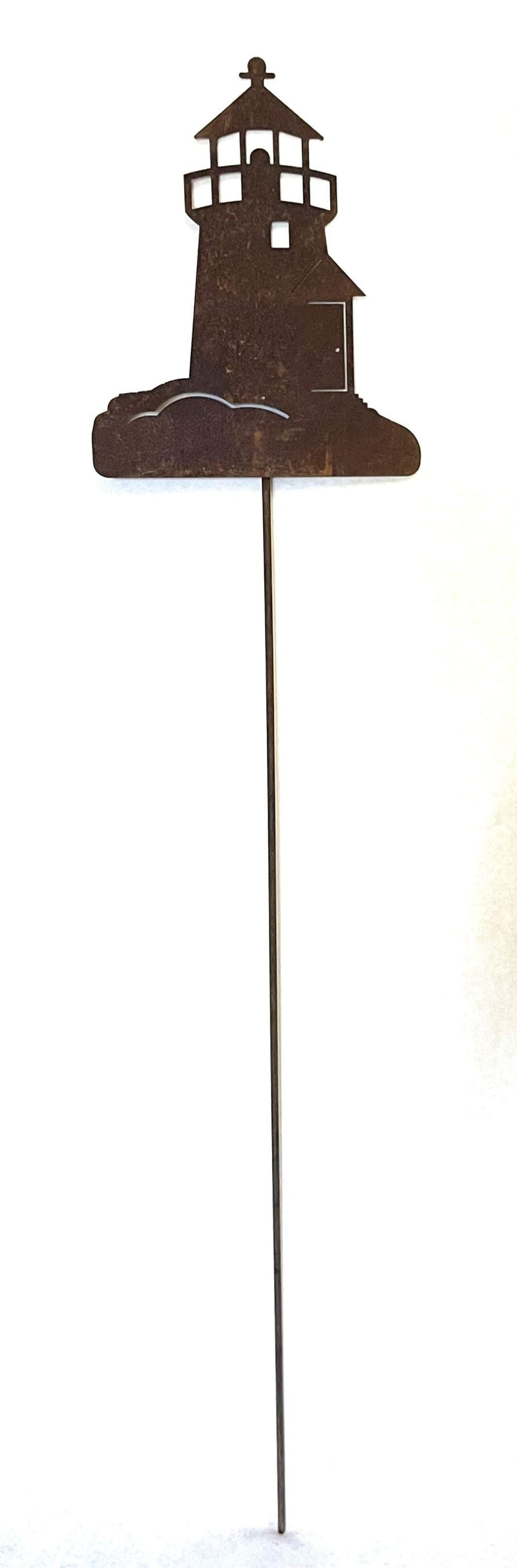 Decorative Lighthouse Rusted Garden Stake with weathered finish, perfect for enhancing coastal-themed garden landscapes or yard displays.