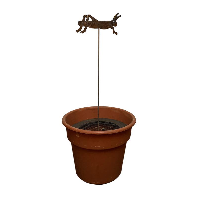 Rusted garden stake with insect decor placed in a flower pot. Perfect for enhancing garden aesthetics with durable metal craftsmanship.