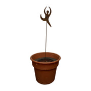 Rustic Dancer Garden Stake displayed in a planter, perfect for adding charm to patios or garden beds, 6 3/8 in. W x 30 in. H metal sculpture.