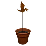 Dove rusted garden stake displayed in a planter pot, adds charming outdoor decor to patios, gardens, or entryways.