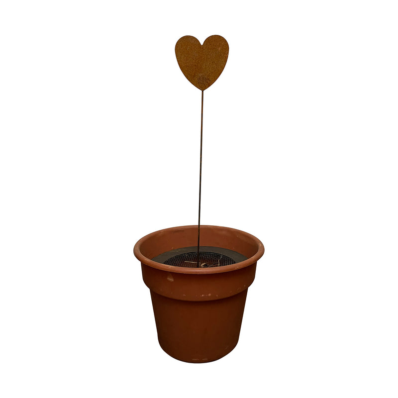 Heart design rusted garden stake displayed in a flower pot, perfect for enhancing patio or garden decor with rustic style.