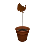 Turkey Garden Stake displayed in a planter pot, showcasing its 30-inch height and rustic charm for outdoor fall-themed decor.