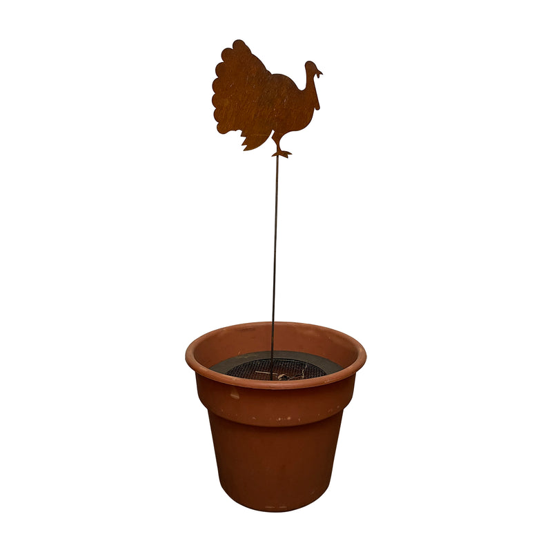 Turkey Garden Stake displayed in a planter pot, showcasing its 30-inch height and rustic charm for outdoor fall-themed decor.