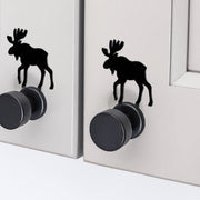 Black moose silhouette cabinet knob accents on light gray cabinet doors, offering a unique decorative hardware solution.