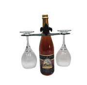Fleur de lis Wine Caddy holding a wine bottle and two glasses, ideal for elegant wine presentation and storage in home bar setups.