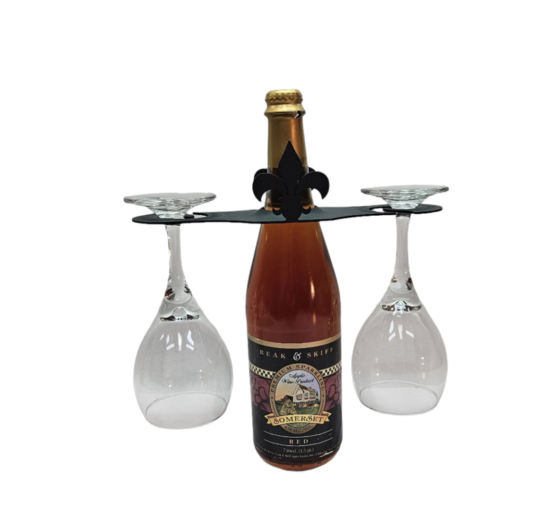 Fleur de lis Wine Caddy holding a wine bottle and two glasses, ideal for elegant wine presentation and storage in home bar setups.