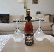 Fleur de lis Wine Caddy displayed on a table in a cozy living room, showcasing its stylish design for wine serving and decor.
