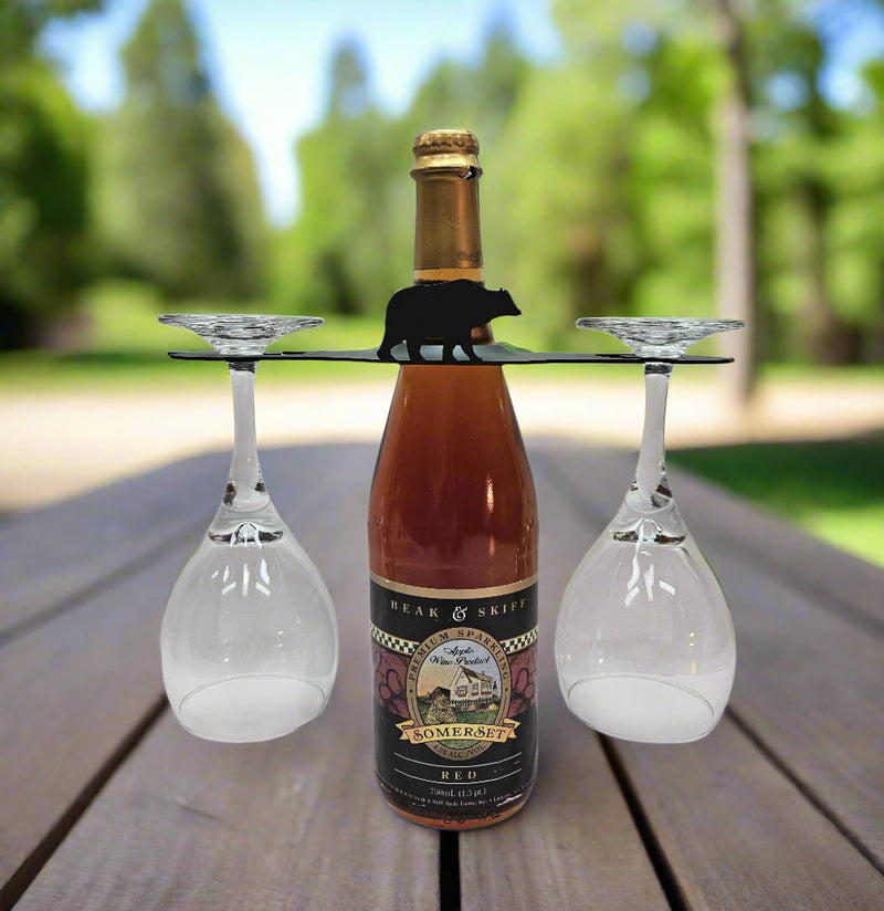 Bear Wine Bottle Holder with 2 Glasses shown outdoors, perfect for wine lovers seeking a rustic and portable wine rack solution.