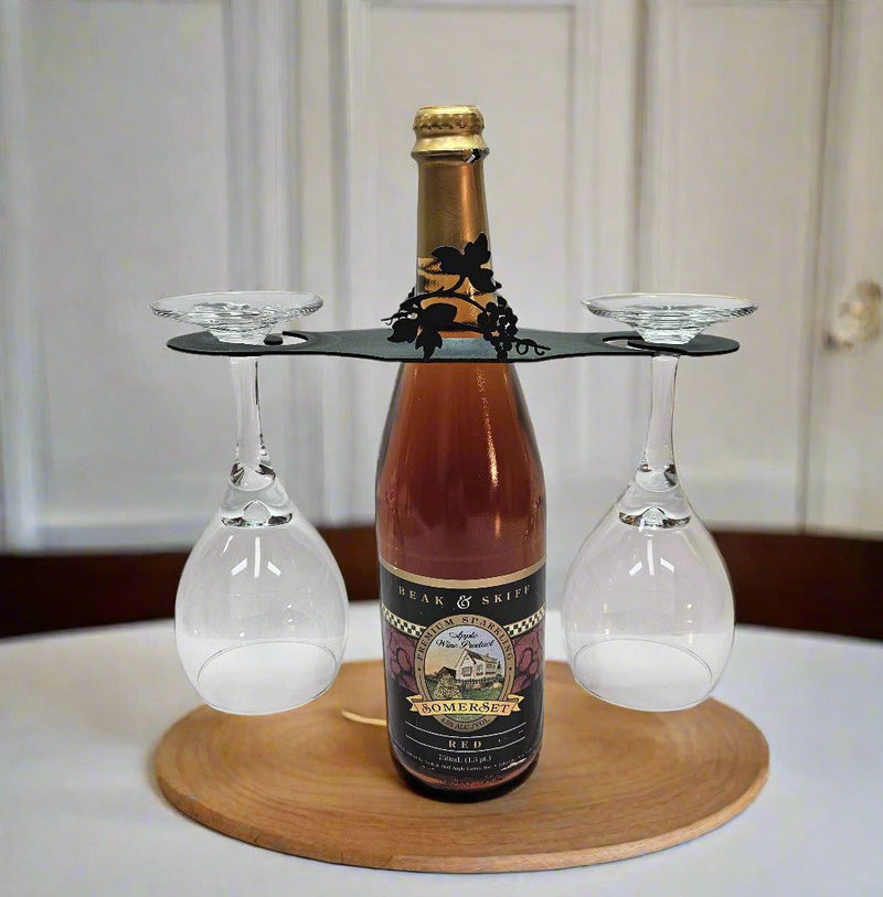 Decorative Grapevine Wine Caddy displayed on a wooden tray with wine bottle and glasses, perfect for holiday or gift settings.