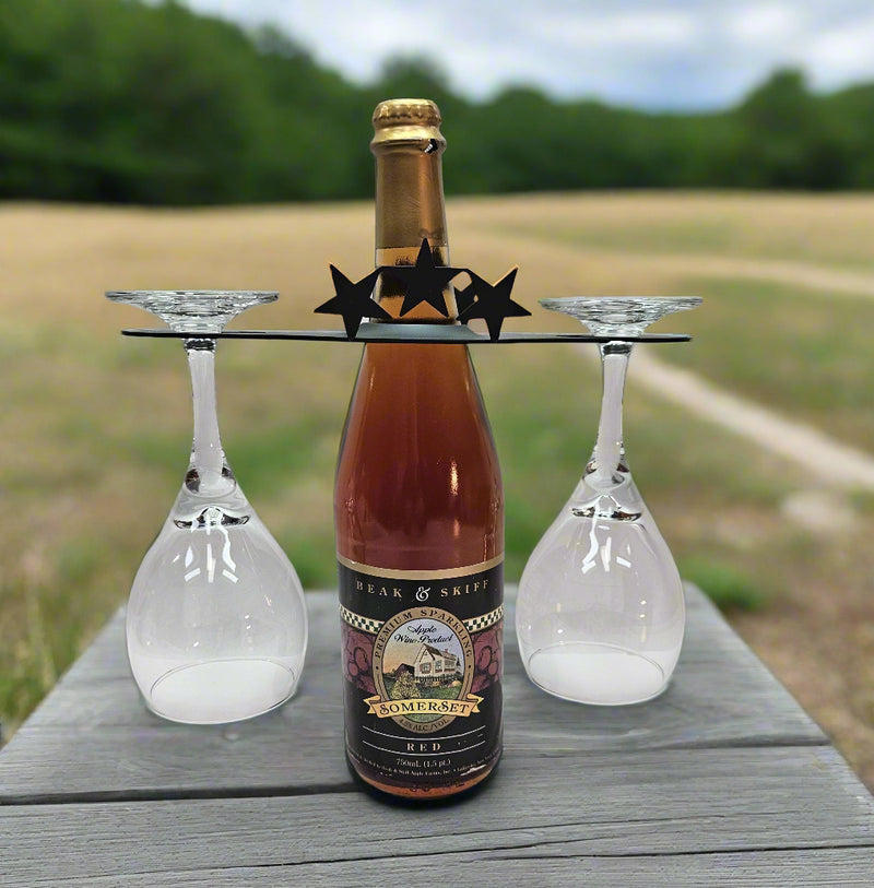 Star Wine Caddy Holder - For 2 Glasses displayed outdoors on a picnic table, showcasing its stylish design and functionality for wine lovers.