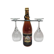 Kokopelli Wine Caddy holding a wine bottle and two glasses, ideal for festive wine presentation and storage in home bar furniture settings.