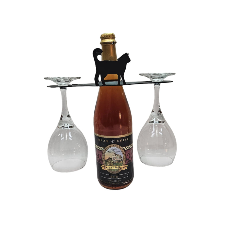 Cat Wine Caddy metal wine rack holds a wine bottle and two glasses with a black cat silhouette, ideal for cat lovers and wine enthusiasts.