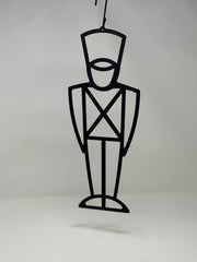 Minimalist Toy Soldier Decorative Hanging Silhouette suspended against a plain background, perfect for seasonal outdoor or indoor decoration.