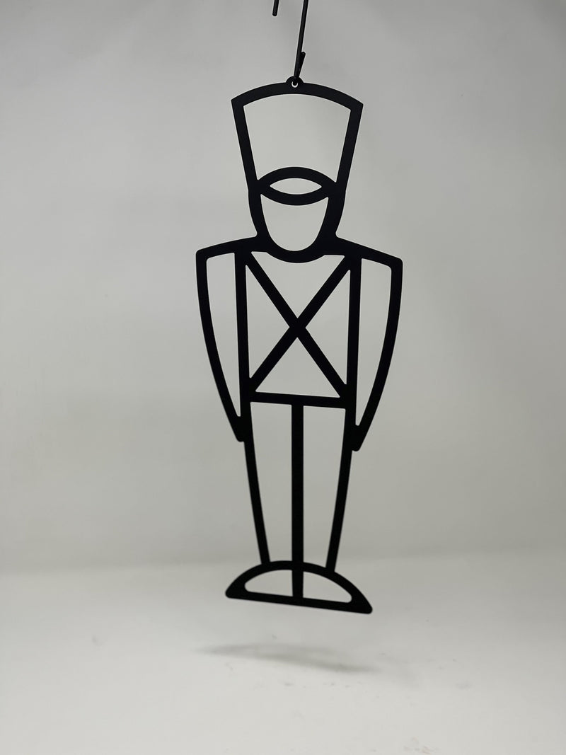 Minimalist Toy Soldier Decorative Hanging Silhouette suspended against a plain background, perfect for seasonal outdoor or indoor decoration.