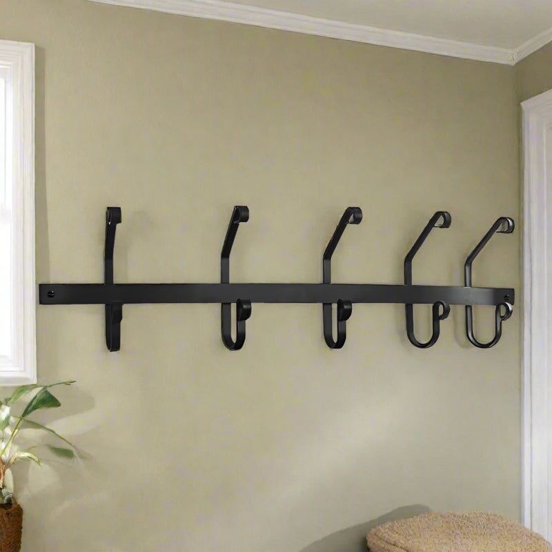 Wall-mounted black metal coat bar with 5 hooks, ideal for organizing coats and hats in entryways or mudrooms. Stylish addition to home decor.