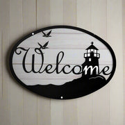 Medium Lighthouse Birds Welcome Sign 12In x 8 3/8In mounted on wood panel, featuring coastal theme with birds and lighthouse for outdoor wall décor.