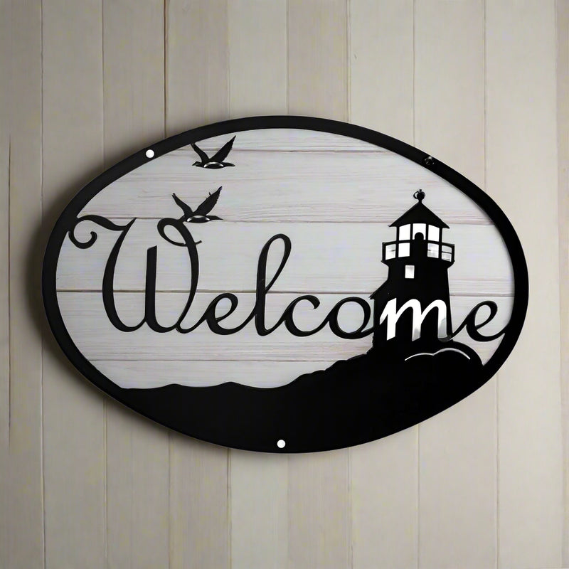 Medium Lighthouse Birds Welcome Sign 12In x 8 3/8In mounted on wood panel, featuring coastal theme with birds and lighthouse for outdoor wall décor.