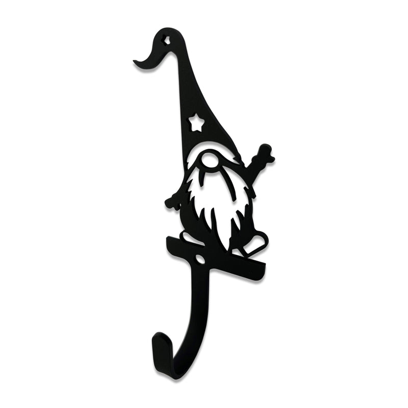 Gnome Wall Hook Small features a black metal gnome silhouette with a curved hat and star cutout, ideal for hanging keys or accessories in home decor.