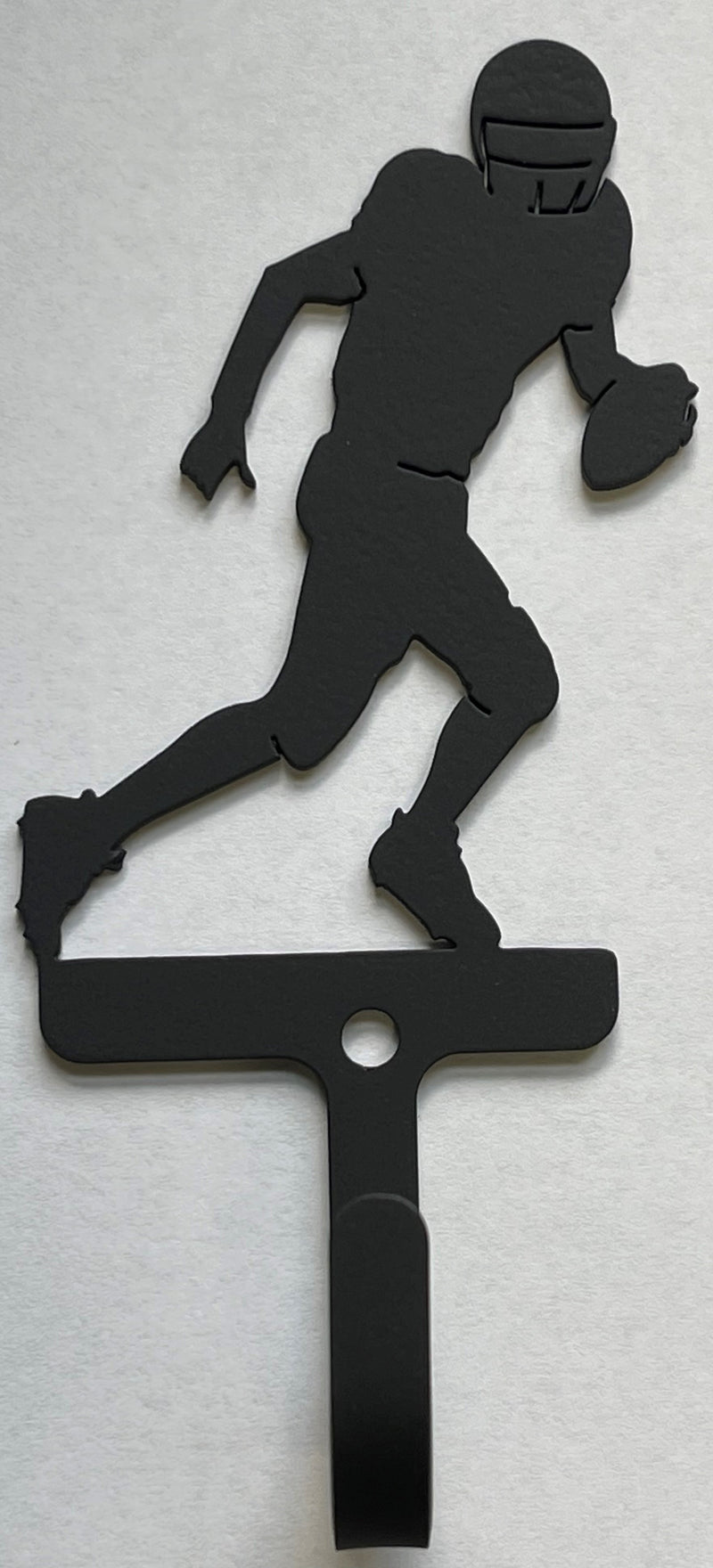 Close-up of Football Player Wall Hook - Small Right-Facing, showcasing detailed silhouette and sturdy hook for organizing items in small areas.