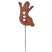 Close-up of rusted ghost garden stake featuring a spooky 'BOO' design, perfect for autumn and rustic lawn ornaments.