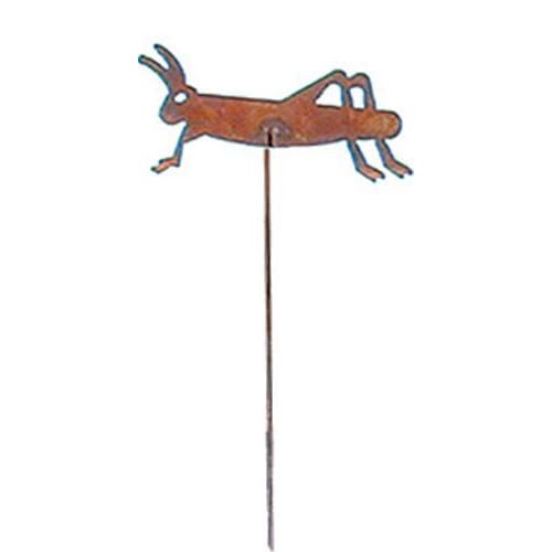 Close-up of rusted metal garden stake featuring a grasshopper design. Adds vintage charm to lawn ornaments and garden sculptures.