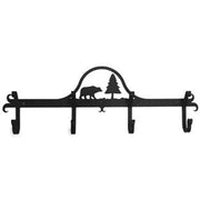 Wall-mounted Bear & Pine Coat Bar in black metal with forest-themed design and five sturdy hooks for coats or towels in cabin-style interiors.