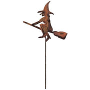 Halloween-themed witch broom garden stake in rustic metal, perfect for outdoor autumn decor in home and garden settings.